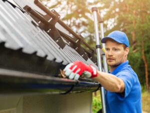 man installing gutter guard