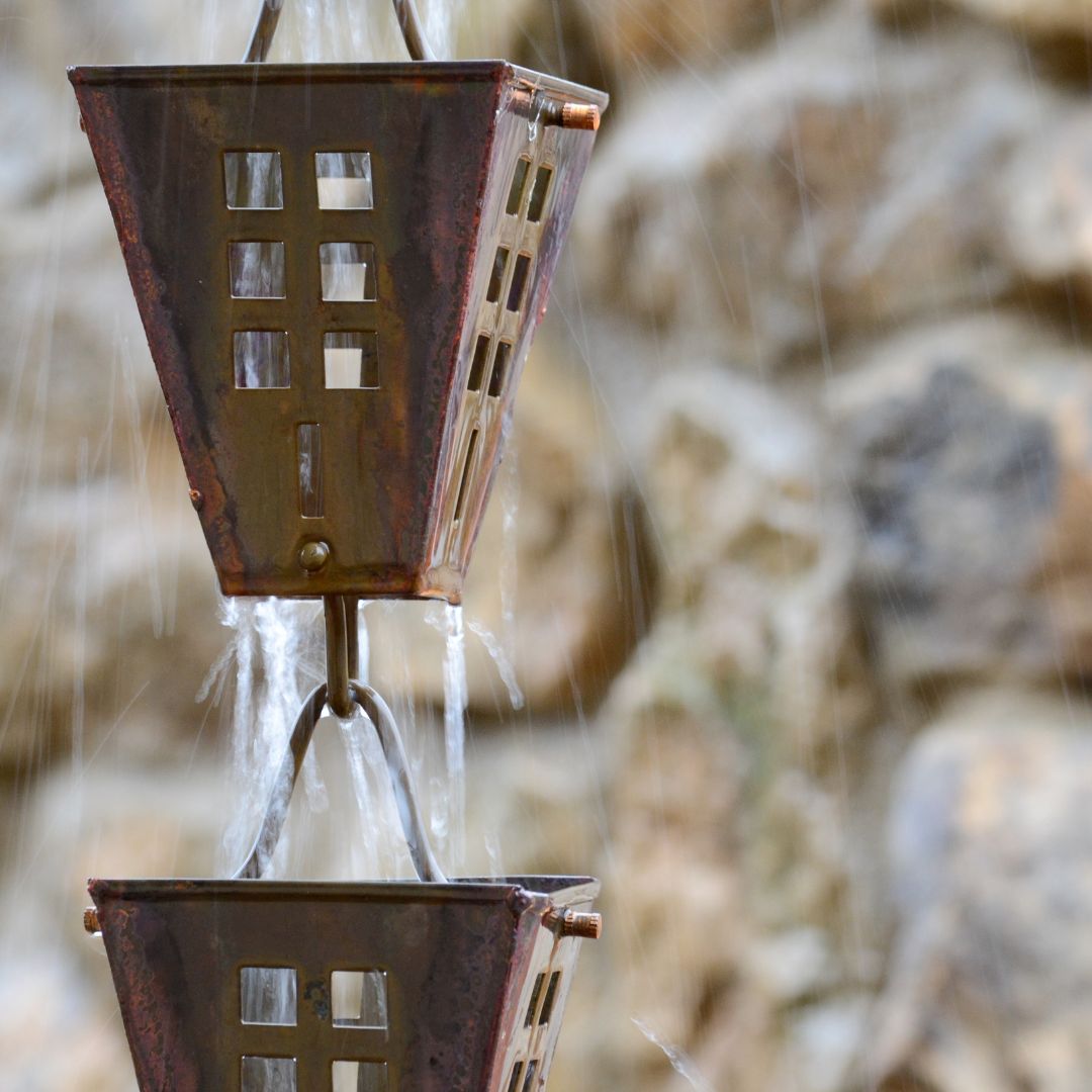 A rain chain controlling the flow of water from gutters
